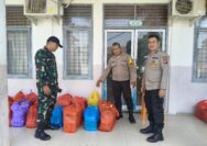 Personil Polri Bantu Pendistribusian Makan Bergizi Gratis.